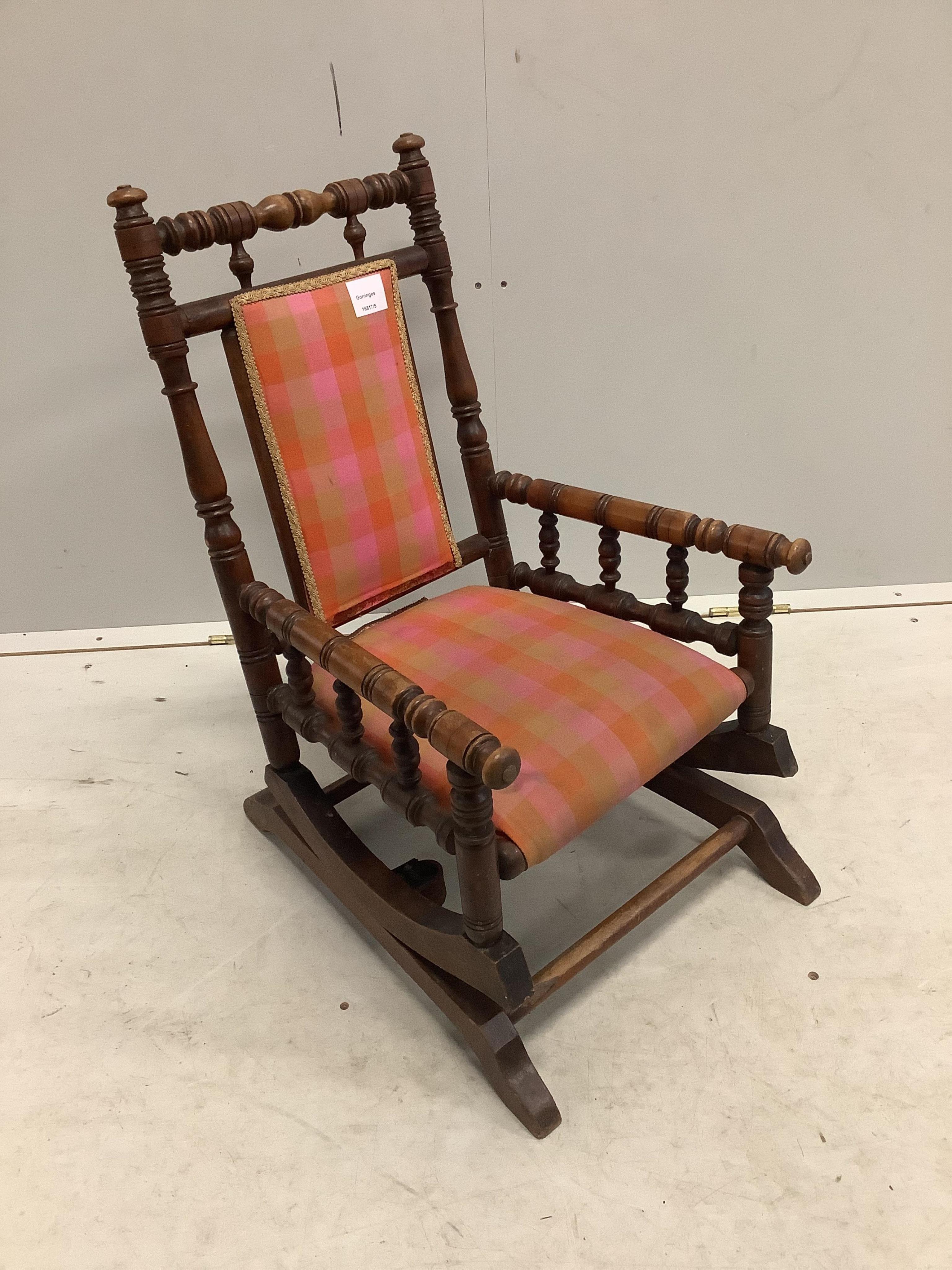 A late 19th century American turned beech child’s rocking chair, width 39cm, depth 49cm, height 66cm. Condition - fair